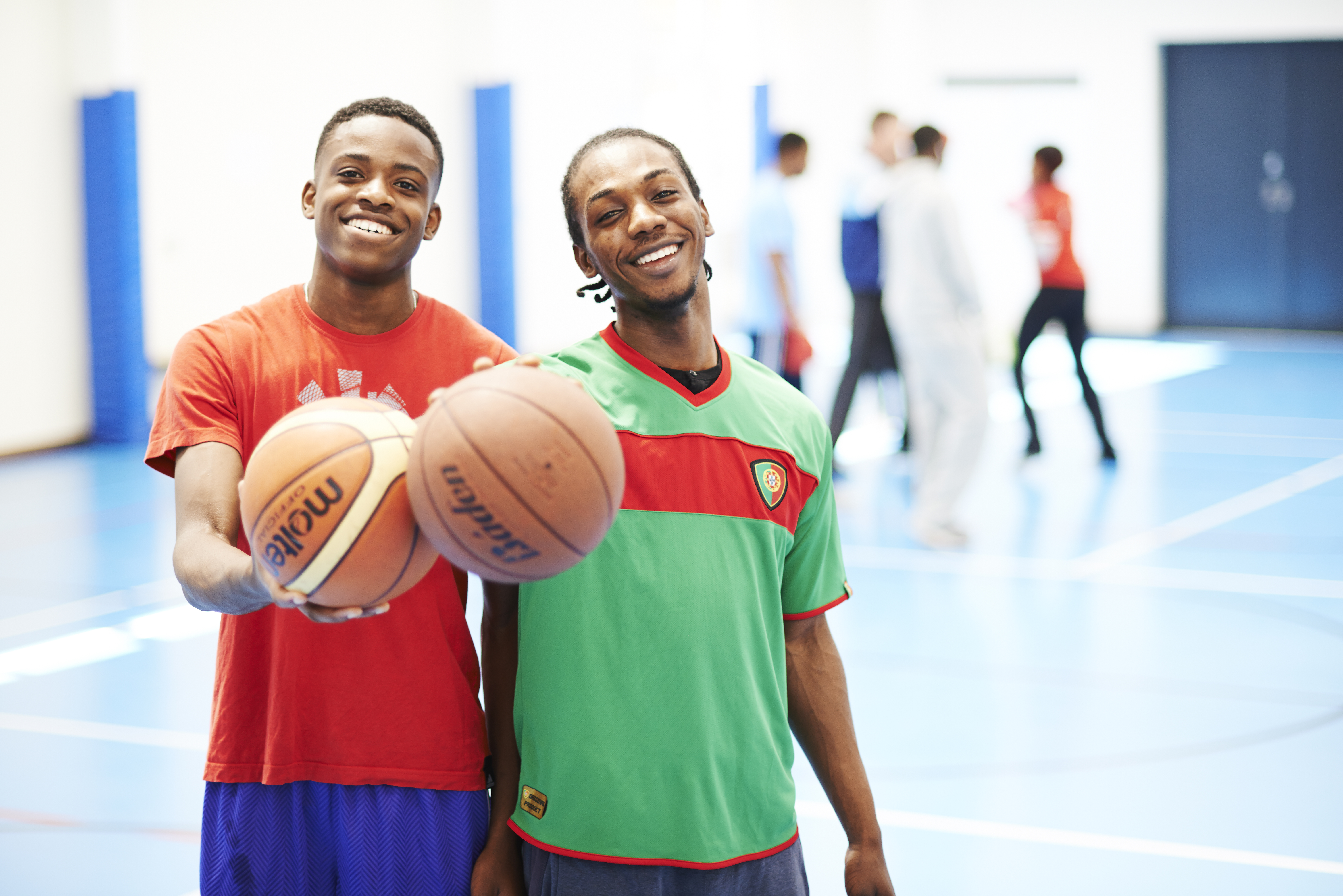 Students holding baskeballs