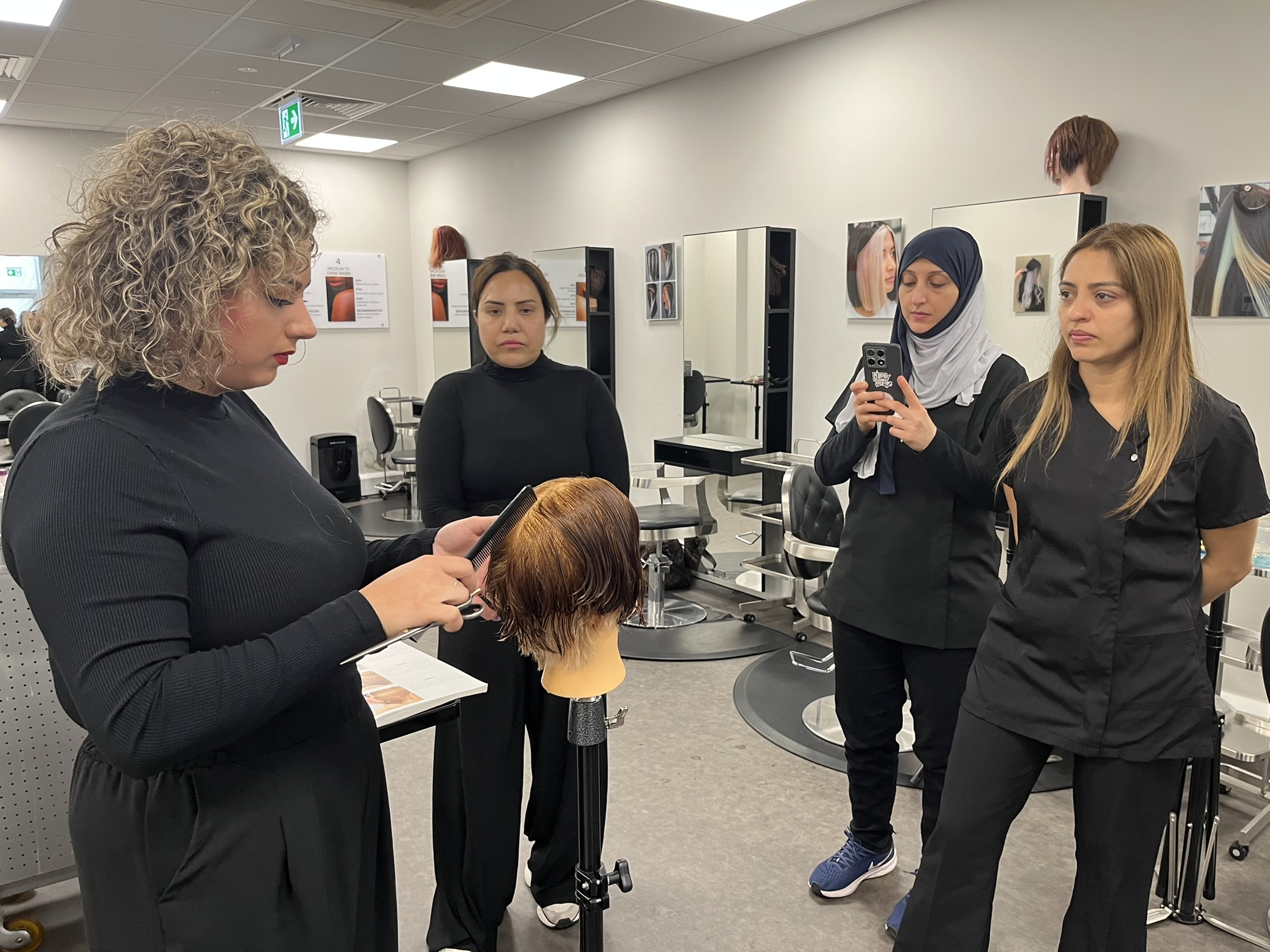 Women learning hairdressing at Salon Hijab