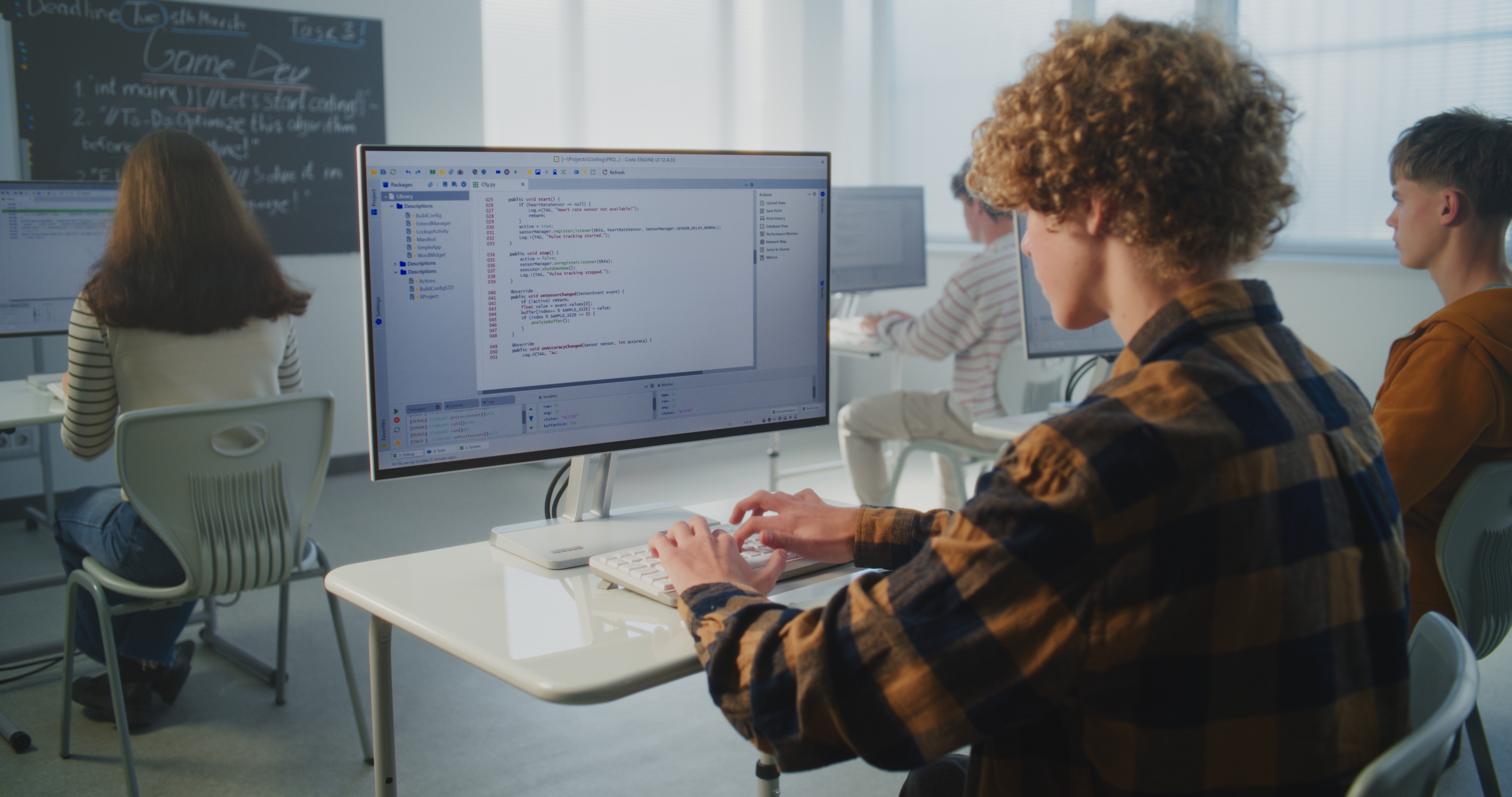 Stanmore College -I.T and Computing. Focused Student Types Computer Code Quickly on Keyboard