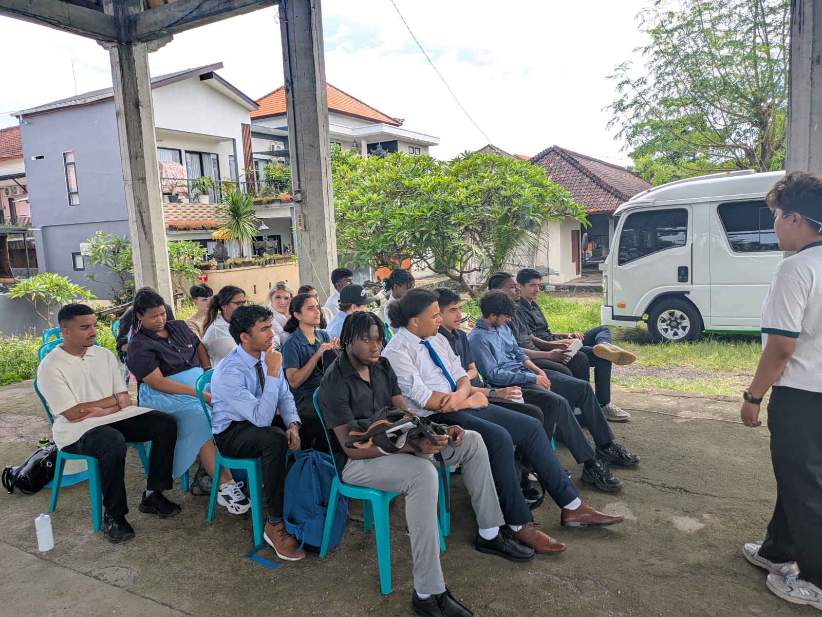 Stanmore College Visit to Bali, receiving a presentation from local community