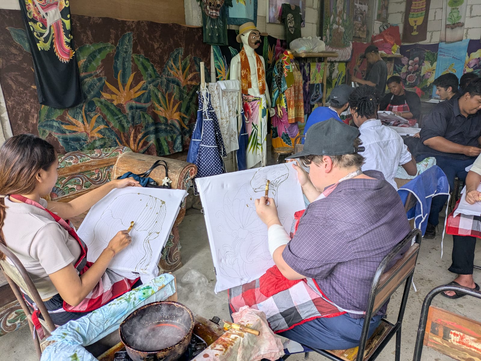 Students drawing on canvas in Bali