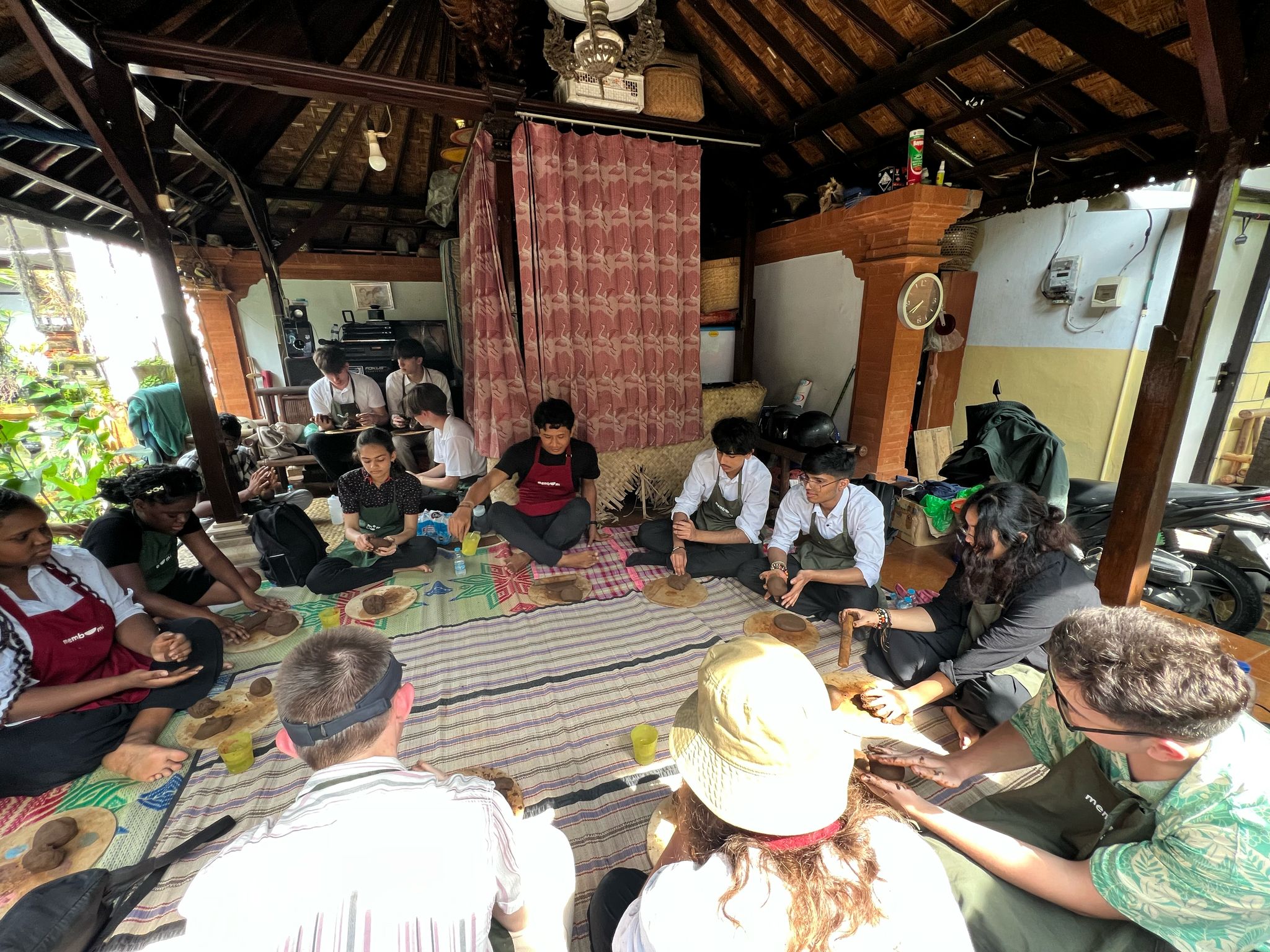 People gathered on floor to practice clay art.