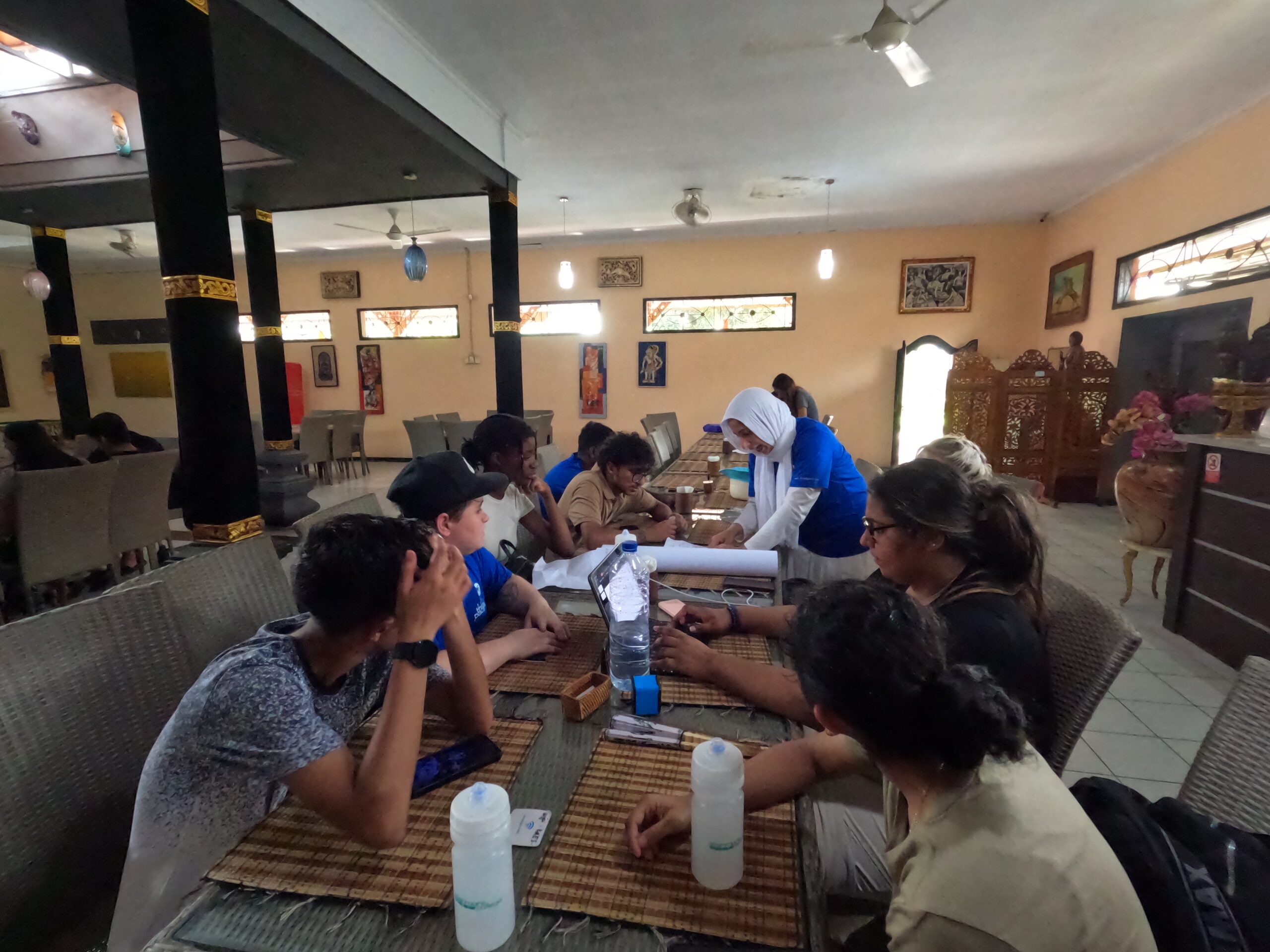 Students gathered at table in Bali