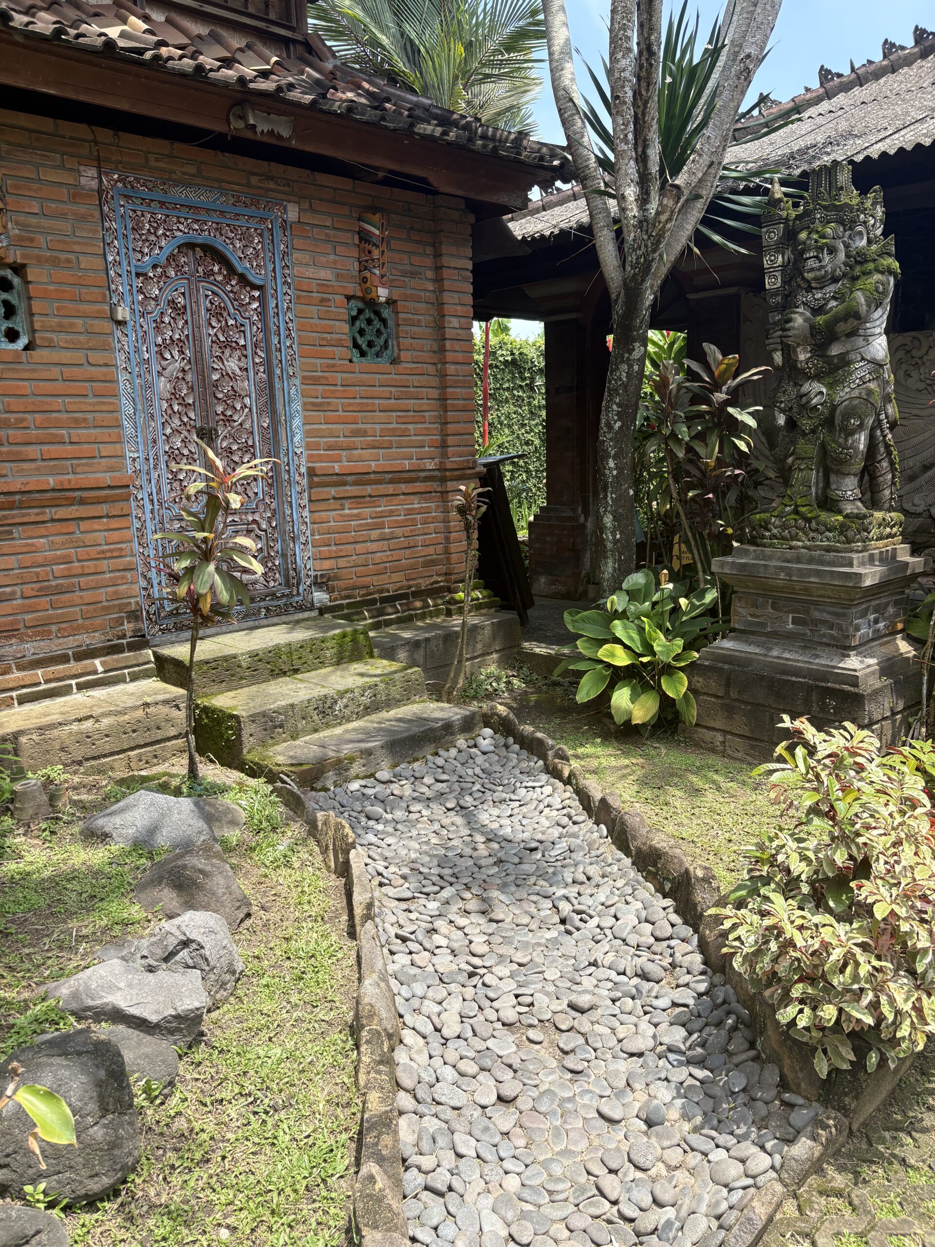 Entrance to shop in Bali with pebble walkway