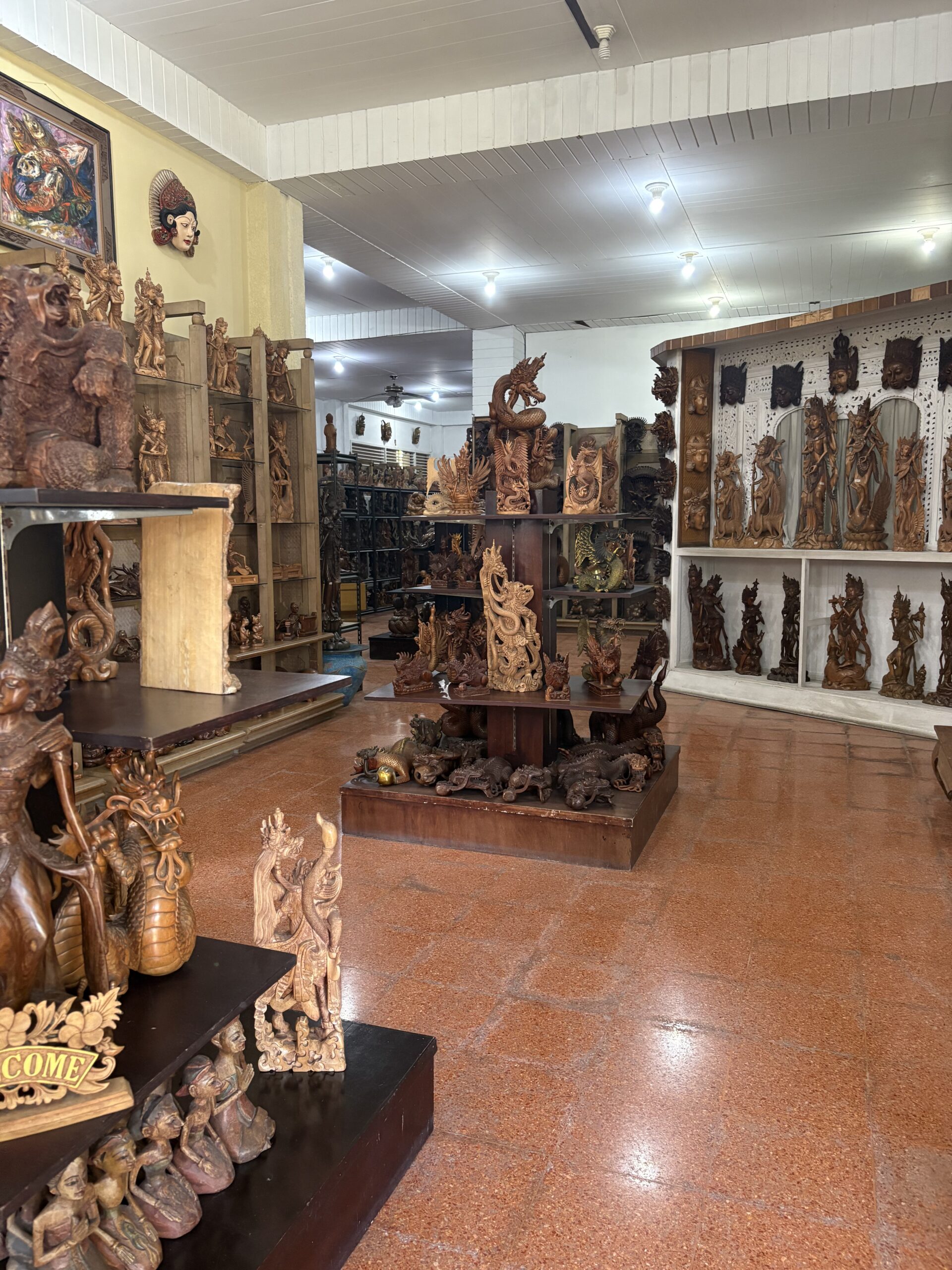 Artefact and statue shop in Bali with wooden and metal carvings