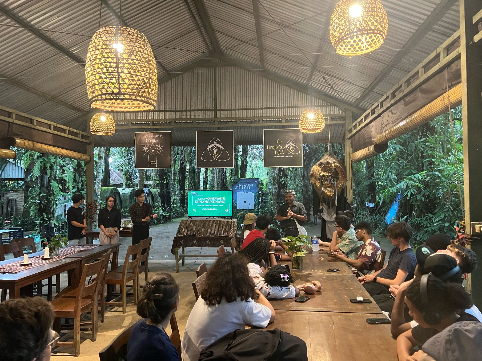 Students gathered around table in Bali