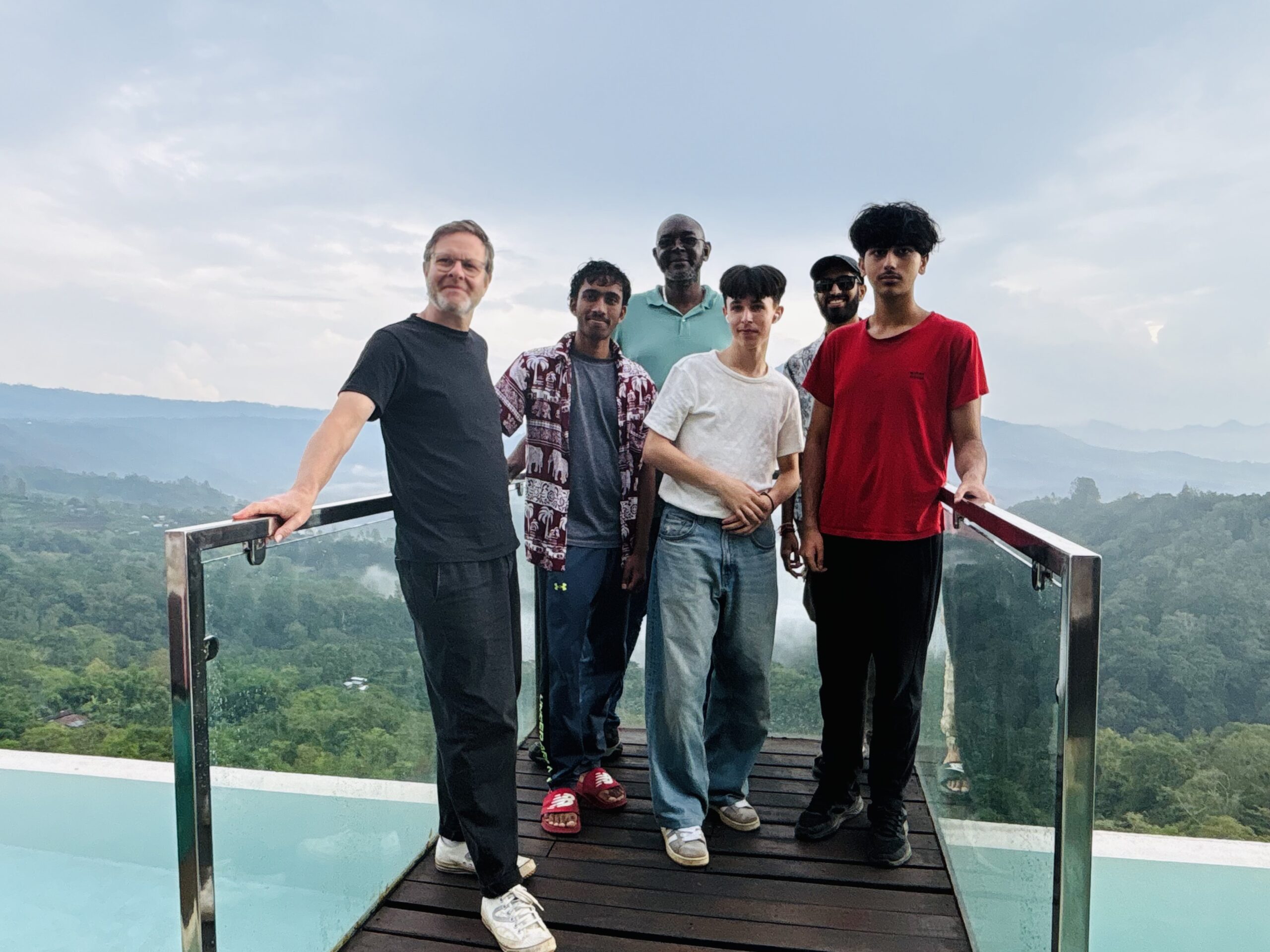 Students standing at edge of view bridge in Bali
