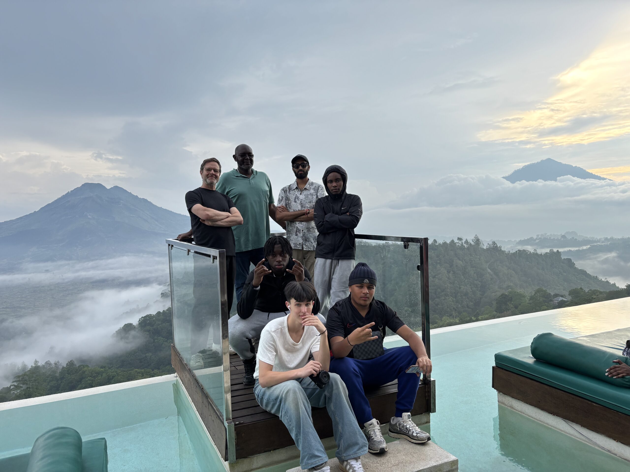 Students standing at edge of view bridge in Bali