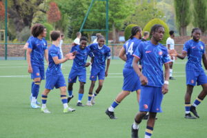 Chelsea Students playing in Cobham Cup Final game and celebrating goal
