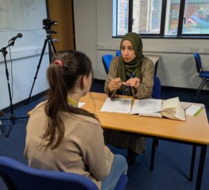 Stanmore College staff interviewing a student.