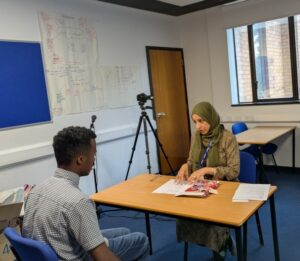 Stanmore College staff interviewing a student.