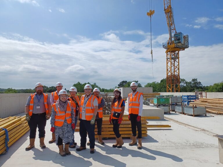 Staff picture on the roof of block b in the new build