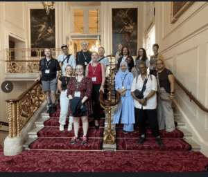 Group of visitirs standing at staircase at Royal Opera House
