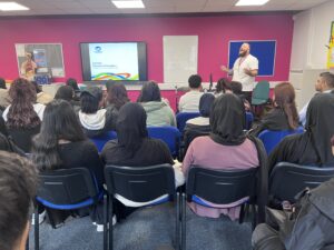 Employee giving talk to students at Stanmore College