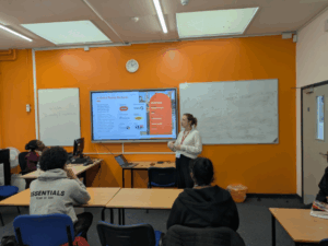 Woman from Bouygues giving talk to students.