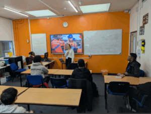 Woman from Bouygues giving talk to students.