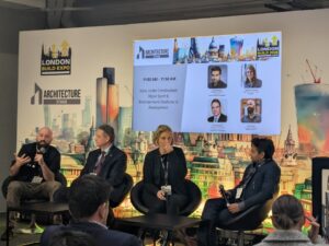 Speaking panel of 4 people at London Building Expo