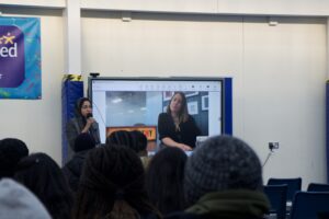 Stanmore College students watch onscreen talk by ITV Academy.