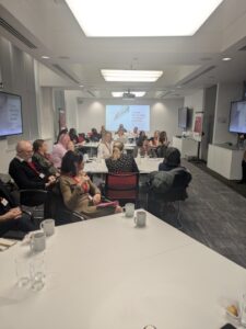 Visitors attending talk in training room