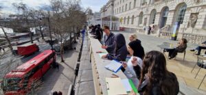 Students standing at Embankment bridge