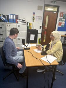 Staff interviewing Stanmore College student.