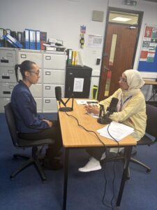 Staff interviewing Stanmore College student.
