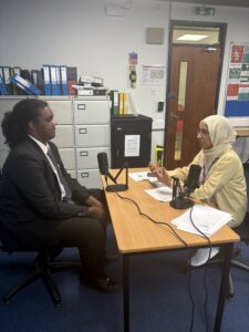 Staff interviewing Stanmore College student.