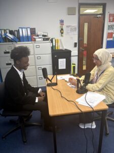 Staff interviewing Stanmore College student.