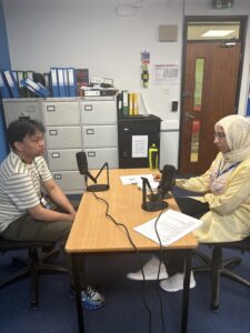 Staff interviewing Stanmore College student.