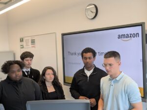 Stanmore College students in front of TV presentation